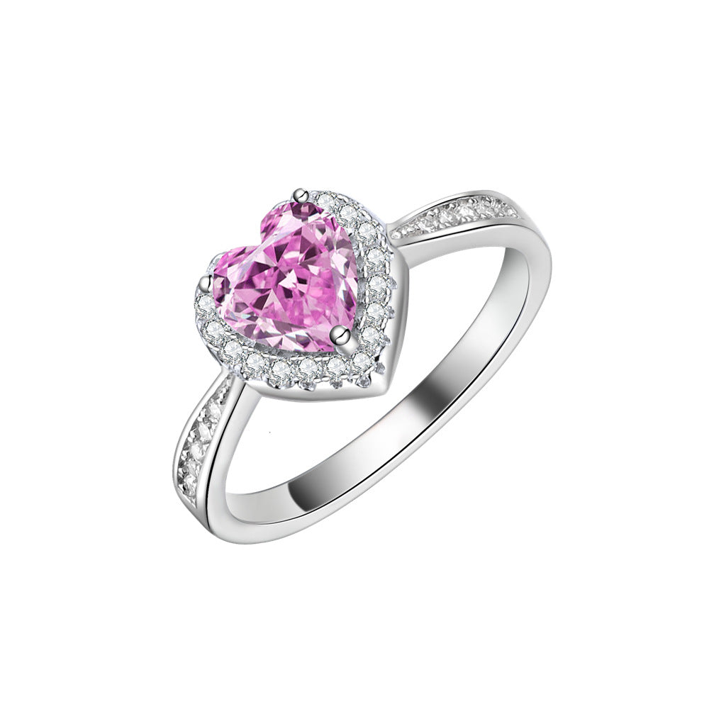 Heart halo ring in 925 sterling silver, side view showing pave-set shoulders