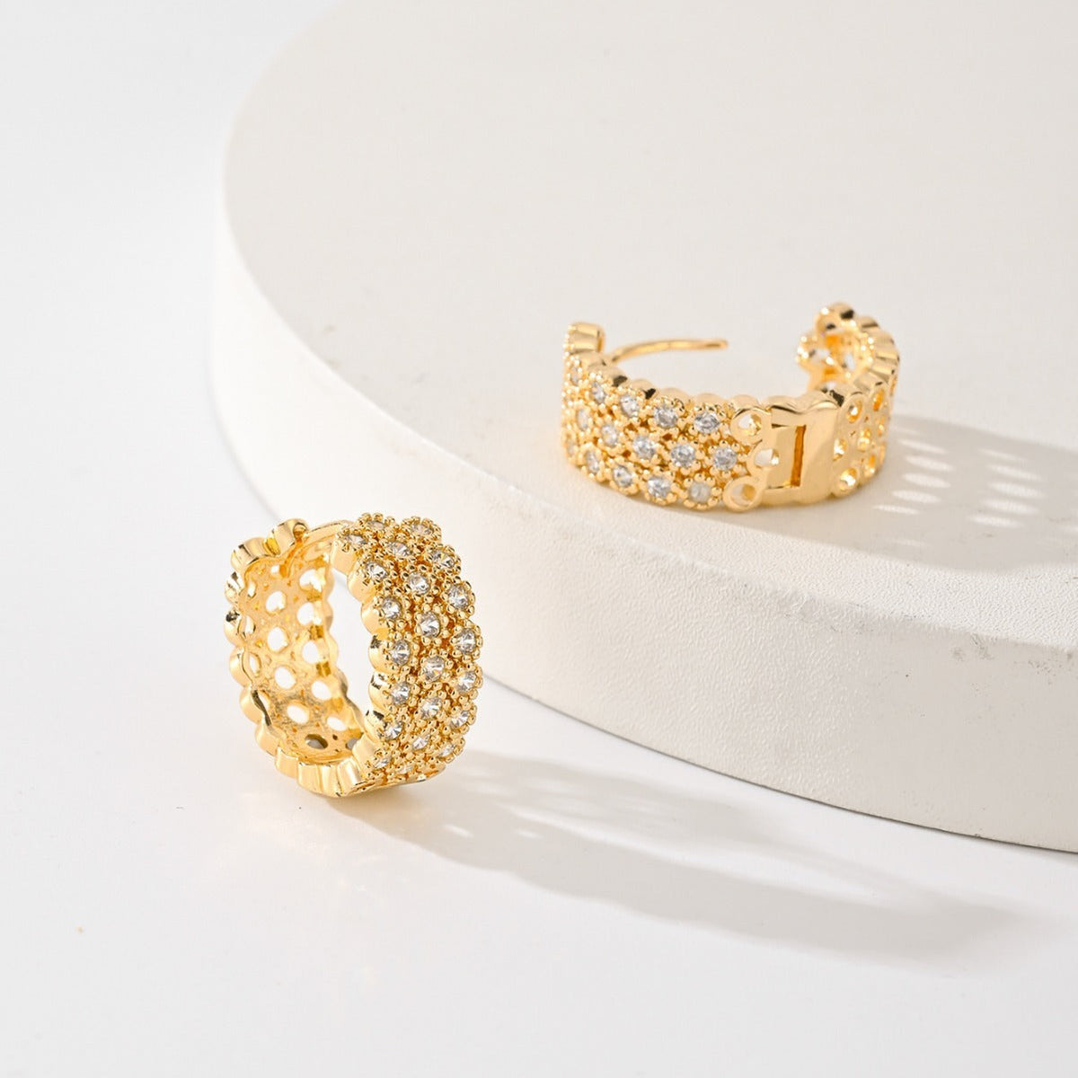 Gold-plated pave huggie hoop earrings, close view