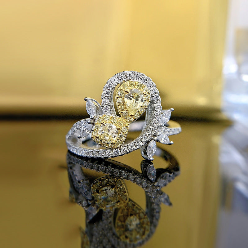 Yellow cubic zirconia floral statement ring in 925 sterling silver, showing the clear stone halos