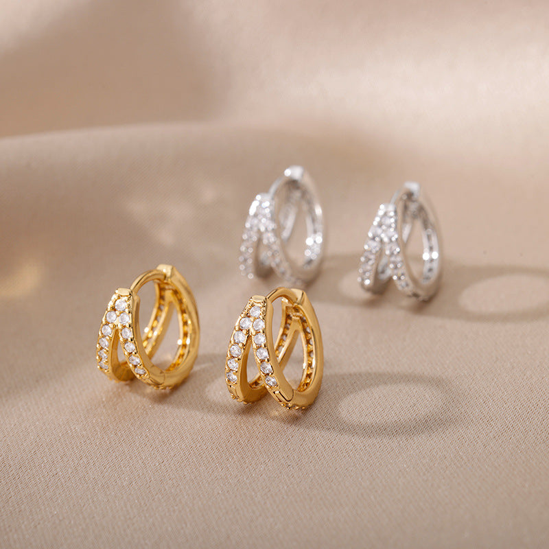 Geometric C-shaped earrings with zircon accents