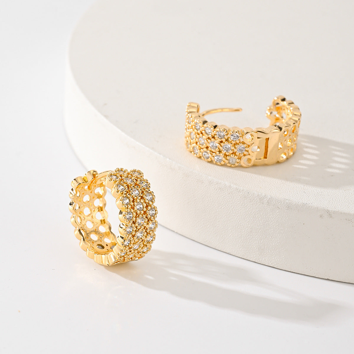 Gold-plated pave huggie hoop earrings, side view