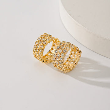Gold-plated pave huggie hoop earrings with three rows of clear stones