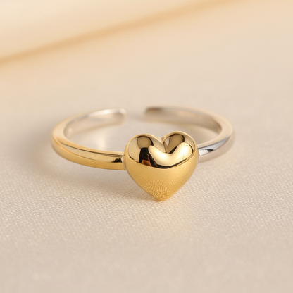 925 sterling silver heart charm ring in gold and silver finish on cream background