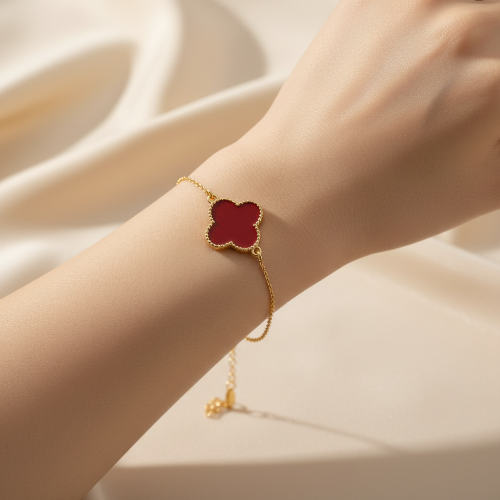 Lucky Four Leaf Clover Charm Bracelet worn on wrist in warm natural light