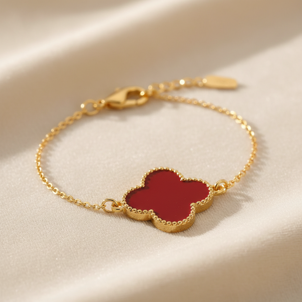 14K gold plated lucky four leaf clover charm bracelet in red on cream background