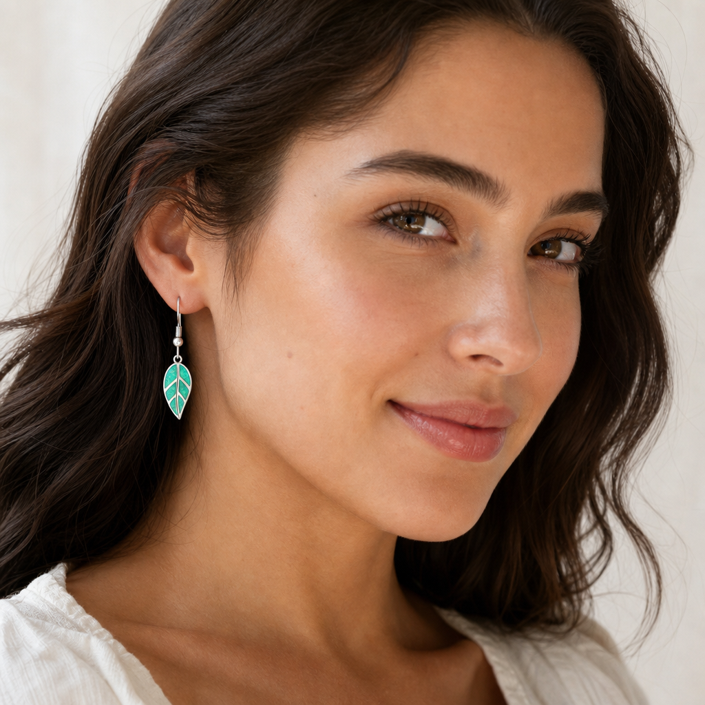 White gold-plated leaf dangle earrings with synthetic green opal